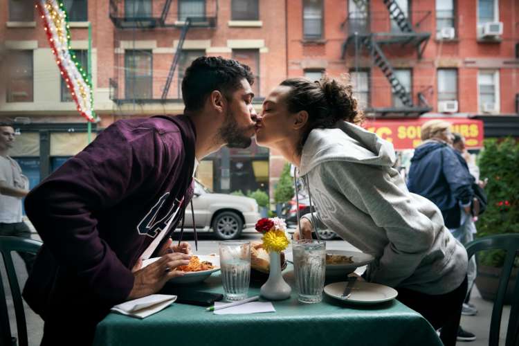 Couple Kissing Over Table